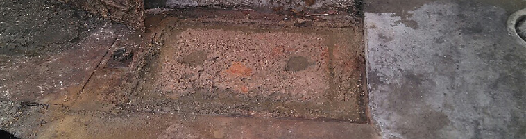 Line blockage causing the grease trap to overflow. Pumping and removing grease